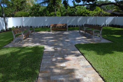 Outdoor seating area with benches and garden