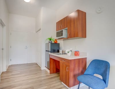 Bright and welcoming resident room with kitchenette