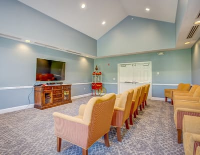 Interior of a common area with seating and television