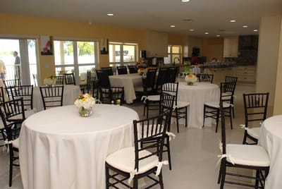 Bright common area with tables and chairs set up