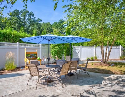 Outdoor seating area with umbrellas and chairs