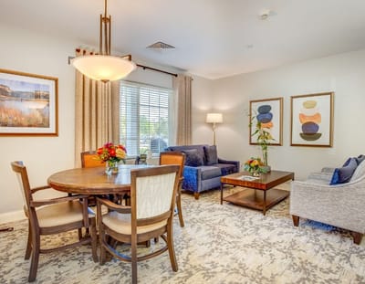 Bright interior of a suite with dining area