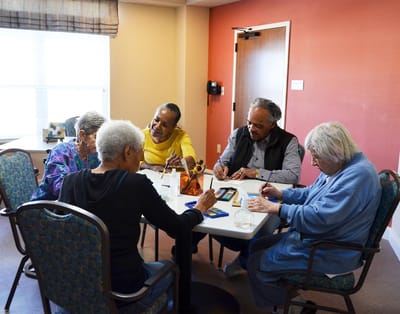 Residents engaging in a creative activity in a common area