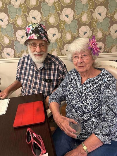 Two residents enjoying a moment together indoors