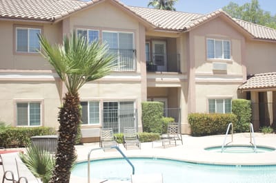 Exterior view of a residential building with pool area