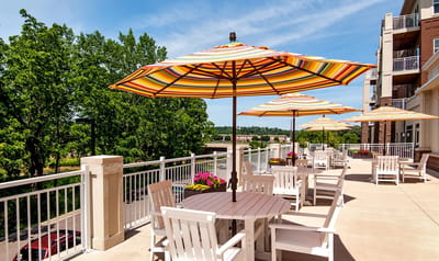 Outdoor patio area with colorful umbrellas and seating