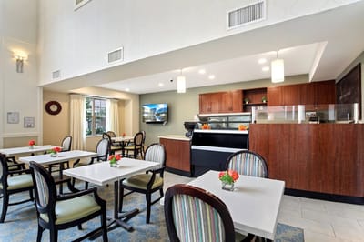 Bright dining area with tables and chairs