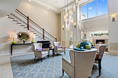 Spacious lounge area with modern decor and seating