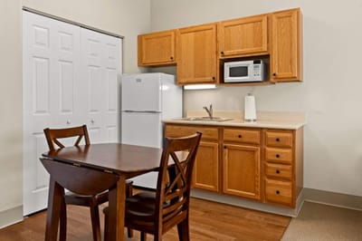 Cozy kitchenette area with dining table and chairs