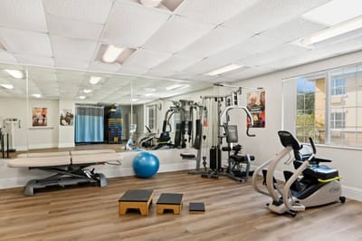 Interior view of a fitness room with exercise equipment