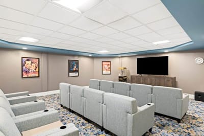 Interior of a cozy movie room with seating