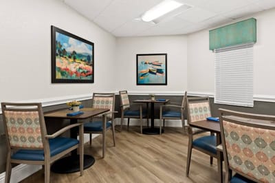 Cozy dining area with artwork and tables