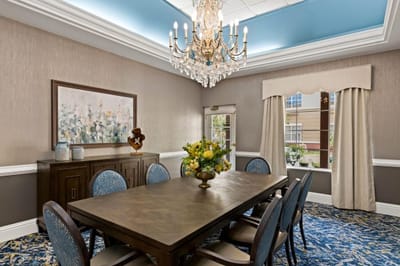 Elegant dining room with chandelier and table setting