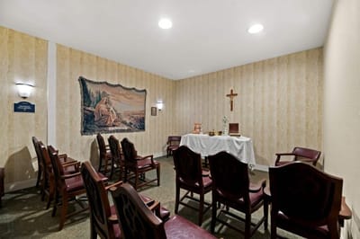 Chapel interior with chairs and religious decor