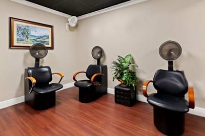 Interior view of a hair salon area with styling chairs