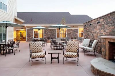 Outdoor patio area with seating and umbrellas