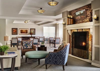 Interior common area with seating and a fireplace
