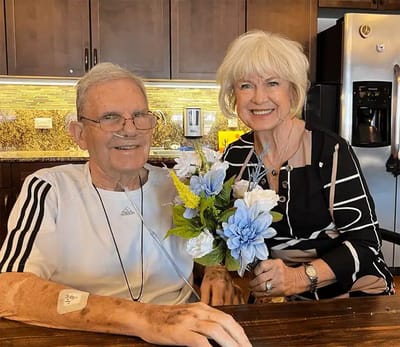 Residents enjoying time together with flowers indoors