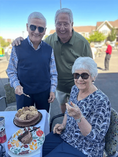 Residents enjoying dessert outside on a sunny day