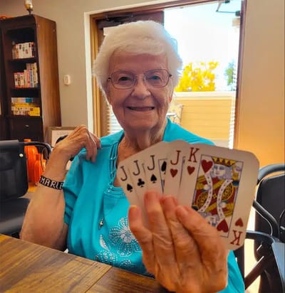 Resident enjoying a card game in a communal area