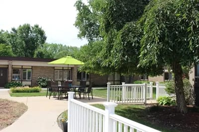 Outdoor seating area with greenery.