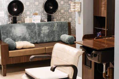 Interior view of a salon area with seating and equipment