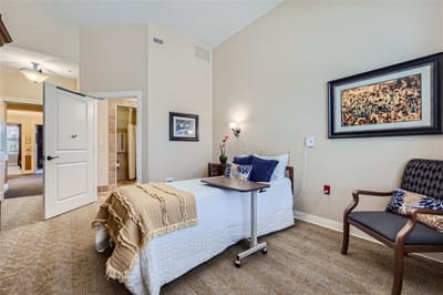 Private resident room with bed and sitting area