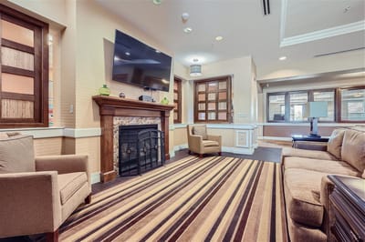 Cozy common area with seating and a fireplace