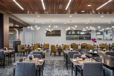 Modern dining room setting with tables and flowers