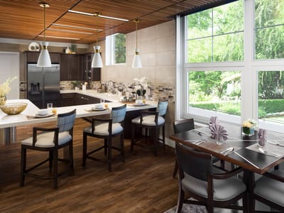 Modern dining room with large windows and outdoor view