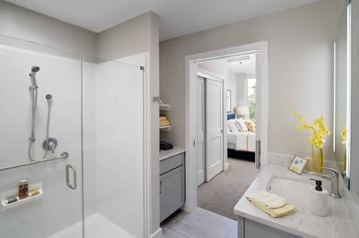 Modern bathroom with a view of a bedroom
