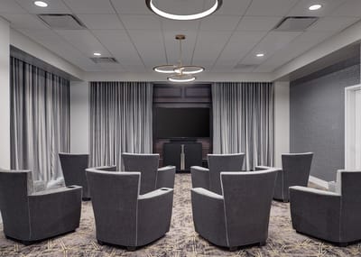 Modern common area with seating and TV