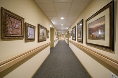 A well-decorated hallway with framed artwork