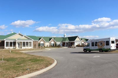 Exterior view of Meadow View Senior Living Community with shuttle bus