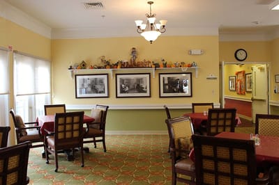 Dining area with tables and historical photos on the wall