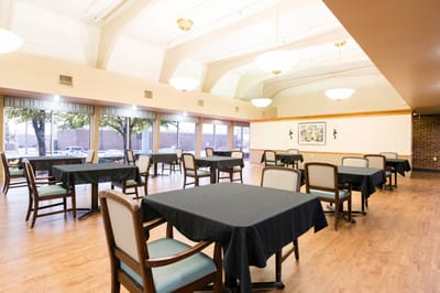 Well-lit dining room setup with empty tables