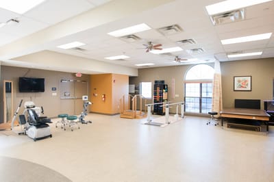 Interior view of a physical therapy area with equipment