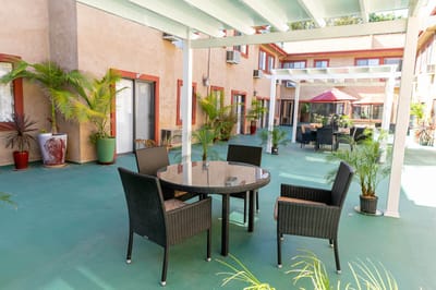 Outdoor seating area with tables and chairs