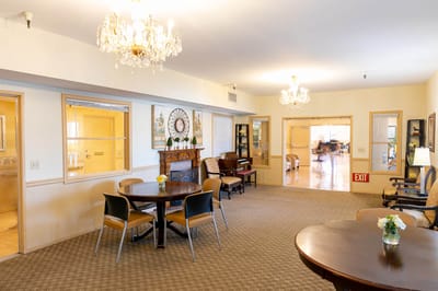 Bright common area with seating and piano