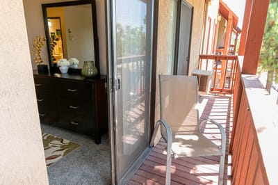 Outdoor balcony with a chair and interior view