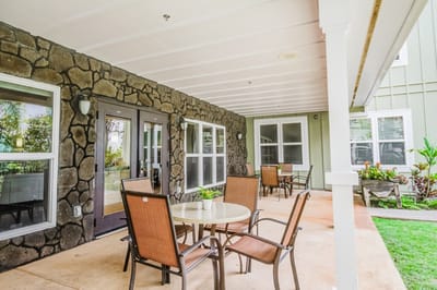 Outdoor seating area with tables and chairs