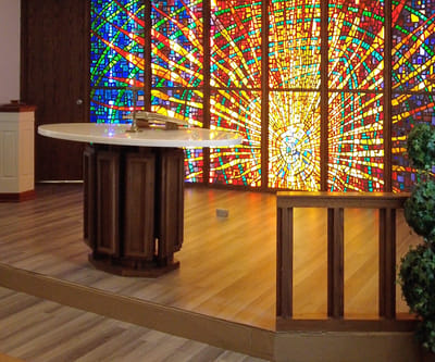 Interior view of a chapel with stained glass windows