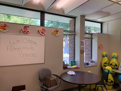 Indoor common area with a welcome message