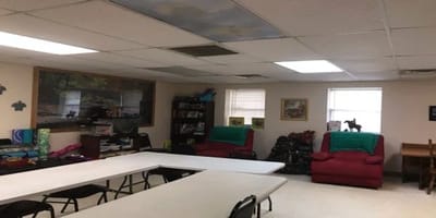 Common area with seating and bookshelves