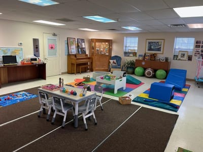 Interior play area with toys and exercise equipment.