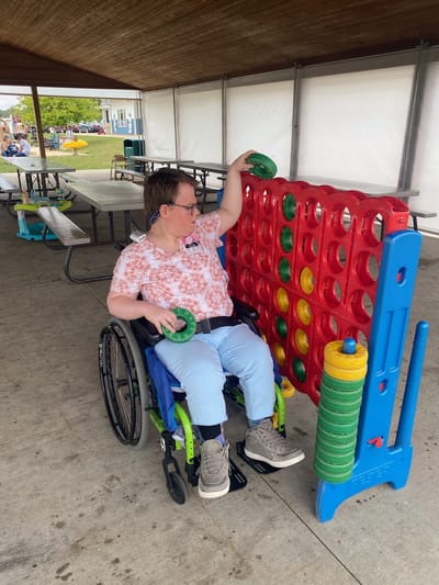Resident engaging in a game outdoors.