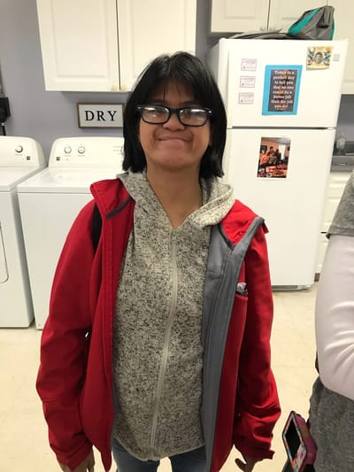Resident smiling in a common area