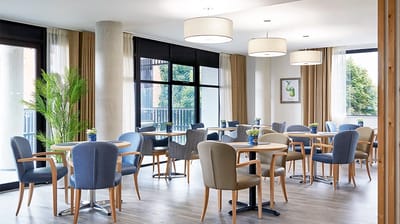 Bright dining area with tables and chairs