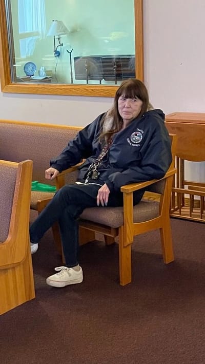 Woman seated in a common area of the facility