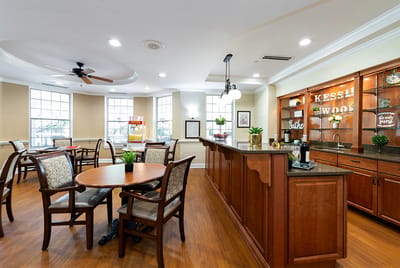 Dining area with tables and a service counter.